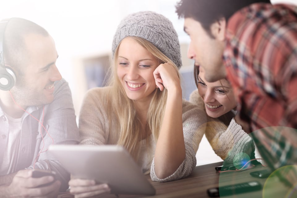 Group of teens using digital technologies